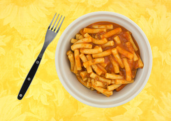 Inexpensive pasta meal in bowl with fork