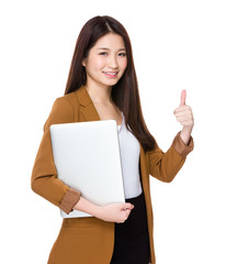 Businesswoman with laptop and thumb up