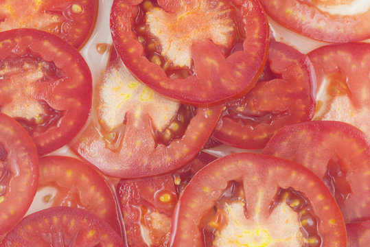 Tomato slices. Natural background with slices of tomato.