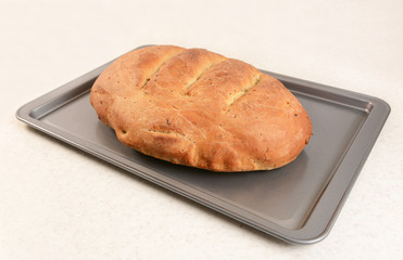 Freshly baked bread with slashed crust
