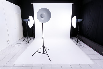 Modern photo studio with lighting equipment