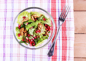 Fresh salad with greens, garnet and spices
