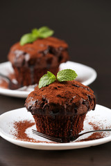 Yummy chocolate cupcake on table