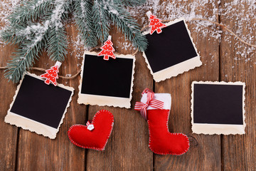 Blank photo frames and Christmas decor with snow fir tree