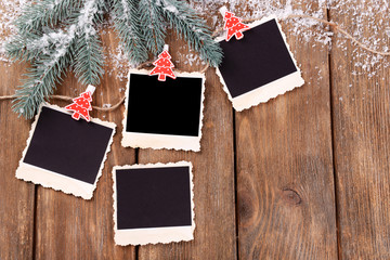 Blank photo frames and Christmas decor with snow fir tree