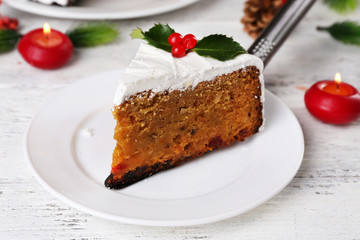 Slice of cake covered cream with Christmas decoration