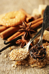 Christmas spices and baking ingredients on sackcloth background