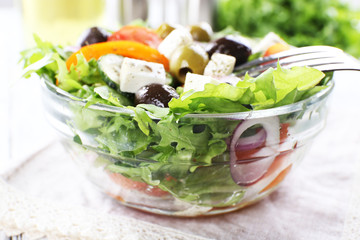 Greek salad in glass dish