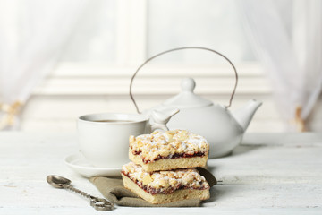 Cup of tea and tasty homemade pie on wooden table