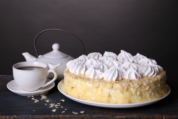 Tasty homemade meringue cake and cup of tea