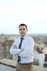 Groom posing on the rooftops