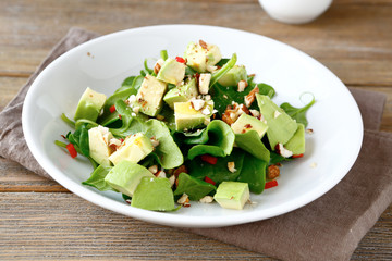 Salad with slices of avocado and spinach