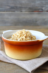 Boiled pearl barley in a pot