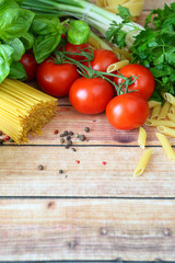 Italian pasta on the wooden background