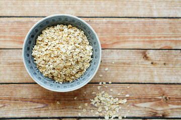 flakes in a bowl on wooden background
