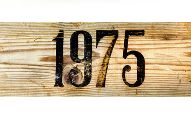 1975 Old Wooden Box on a White Background