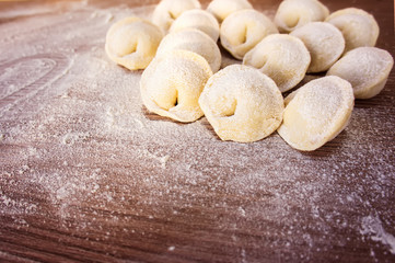 Fototapeta na wymiar Homemade pasta ravioli over wooden table