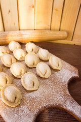 Fototapeta na wymiar Homemade pasta ravioli over wooden table
