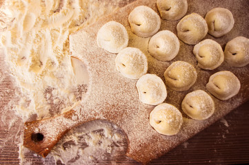 Raw Meat ravioli Russian traditional pelmeni with meat, top view