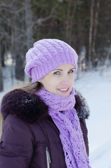 The beautiful smiling woman on winter walk