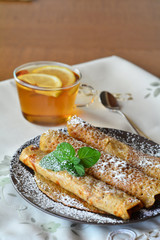 Crepes With Strawberry Jam With Cup Of Tea.
