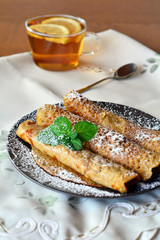 Sweet Crepes With Strawberry Jam With Cup Of Tea.
