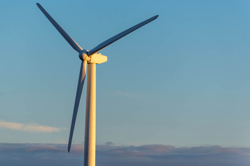 renewable energy - wind turbines against a blue sky