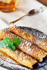 Sweet Crepes With Strawberry Jam With Cup Of Tea.