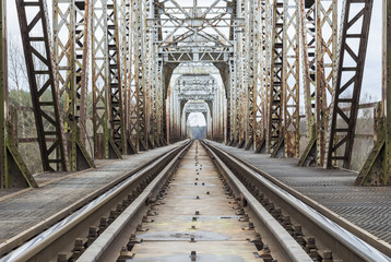 Naklejka premium Railway trucks going through bridge