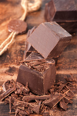 Dark chocolate on wooden background