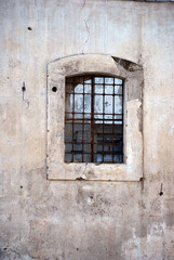 Fototapeta na wymiar Ruin window with iron bars