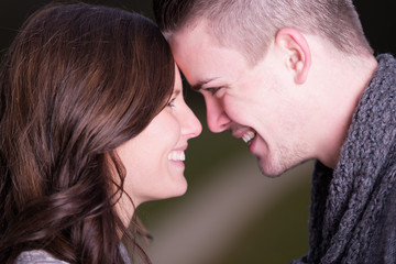 Closeup of a happy young couple face to face