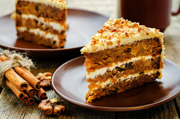 carrot cake with walnuts, prunes and dried apricots - obrazy, fototapety, plakaty