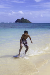 teenage boy on skim board