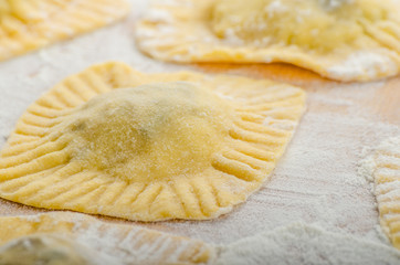 Homemade ravioli stuffed with spinach and ricotta