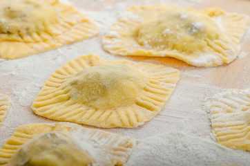 Homemade ravioli stuffed with spinach and ricotta