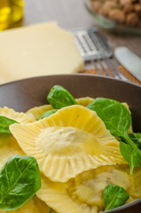 Homemade ravioli stuffed with spinach and ricotta