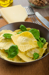 Homemade ravioli stuffed with spinach and ricotta