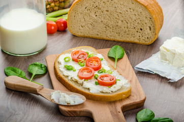 Fresh bread smeared with cream cheese
