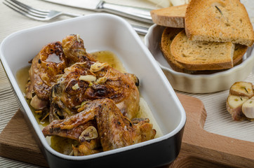 Roasted chicken parts with bio garlic, herb-garlic toast