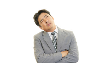 疲れた表情のビジネスマン