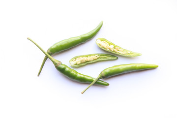 Green chilli peppers on isolated white background