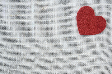 Red Heart on Burlap Background