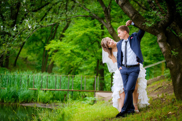 Fototapeta premium the bride and groom walk in the park