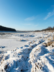 beautiful snowy winter landscape with frozen river