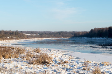beautiful snowy winter landscape with frozen river