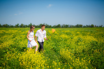 Fototapeta premium love story. man and woman to catch butterfly nets