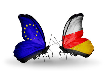 Two butterflies with flags EU and South Ossetia