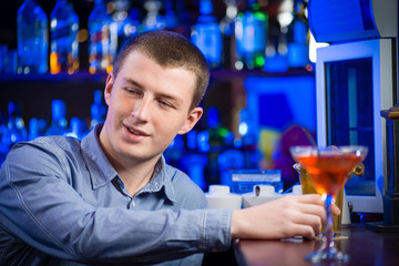 portrait of a young man at the bar