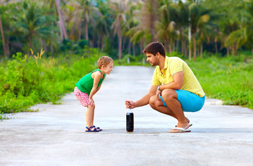 father and son making chemical experiment, funny education